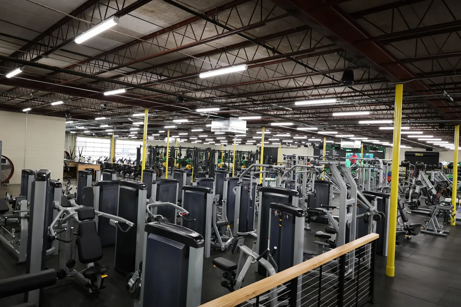 Weight-stack machines across the training floor