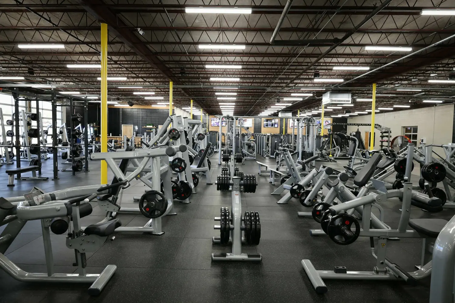 Rows of strength machines on the Downtown Gym floor